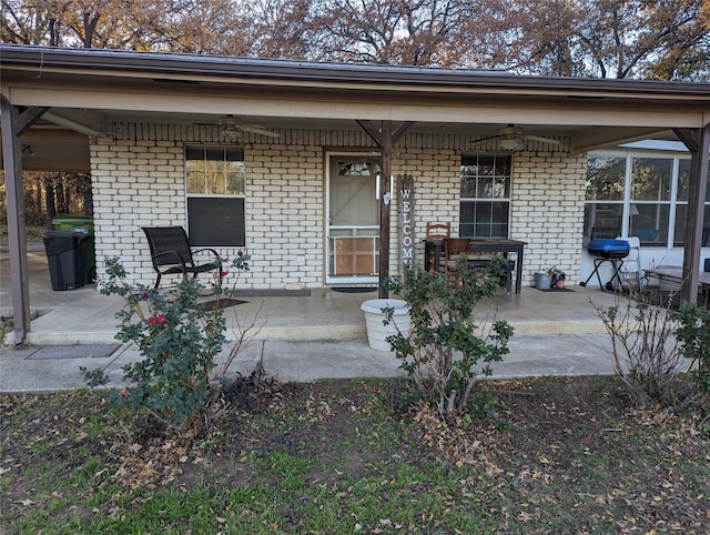 exterior space featuring grilling area and ceiling fan