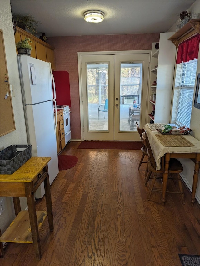 doorway to outside featuring dark hardwood / wood-style floors and french doors