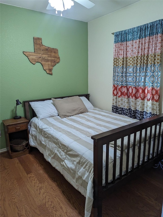 bedroom with ceiling fan and hardwood / wood-style flooring