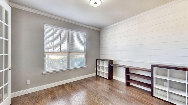 unfurnished office featuring dark hardwood / wood-style flooring, french doors, and ornamental molding