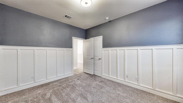 spare room with light colored carpet