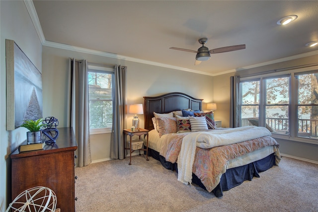 bedroom featuring light carpet, ceiling fan, and crown molding