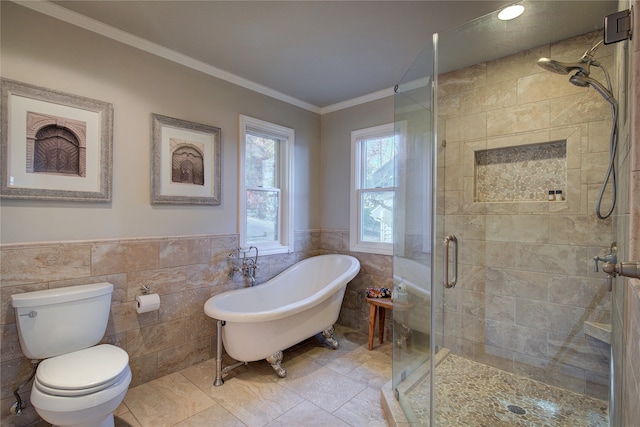 bathroom with shower with separate bathtub, ornamental molding, tile walls, and toilet