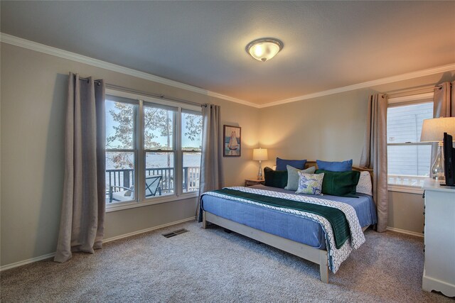 carpeted bedroom featuring ornamental molding