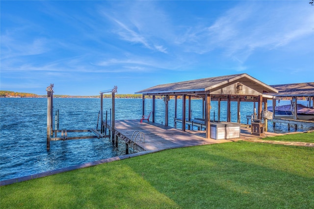 dock area featuring a yard and a water view