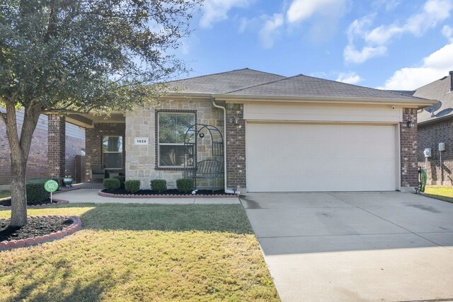 ranch-style house featuring a front lawn and a garage