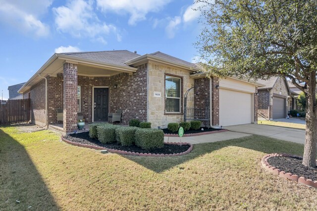 ranch-style house featuring a front lawn and a garage