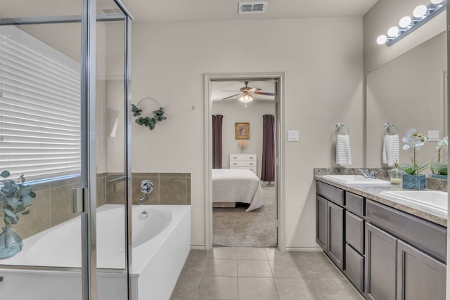 bathroom featuring tile patterned flooring, vanity, and independent shower and bath