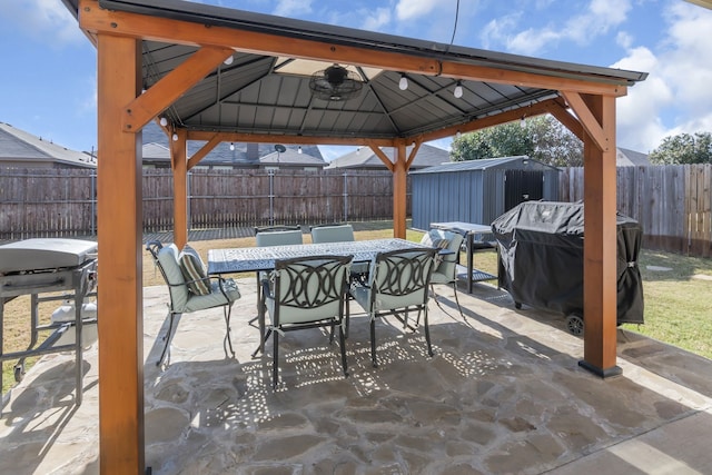 view of patio / terrace with a gazebo, ceiling fan, and grilling area