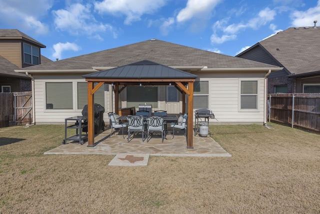 view of patio featuring a gazebo and a grill