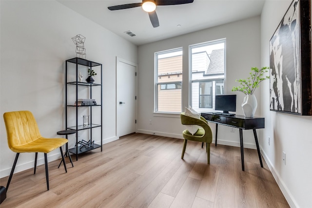 office space with ceiling fan and light hardwood / wood-style flooring