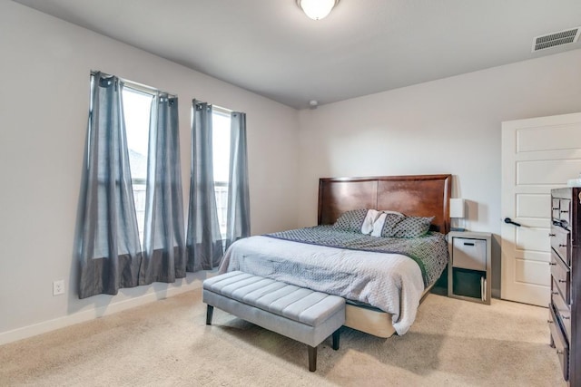 bedroom featuring light colored carpet