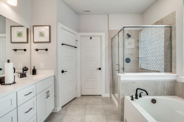 bathroom featuring vanity, plus walk in shower, and tile patterned flooring