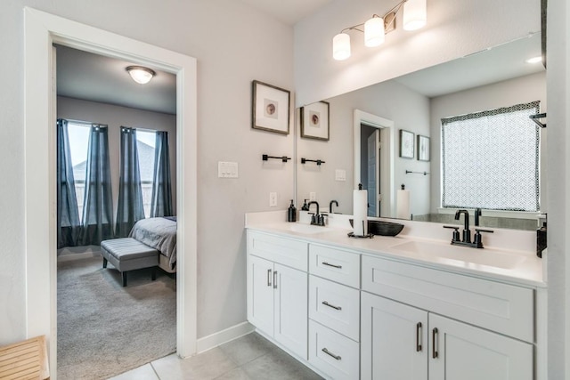 bathroom with tile patterned flooring and vanity