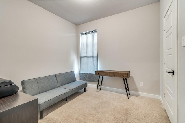 sitting room with light colored carpet