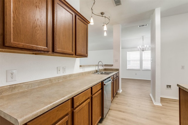 kitchen with decorative light fixtures, sink, a chandelier, light wood-type flooring, and stainless steel dishwasher