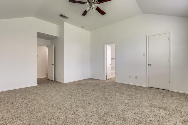 unfurnished bedroom featuring ensuite bath, light colored carpet, ceiling fan, and lofted ceiling