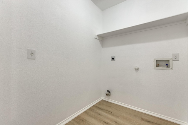 clothes washing area featuring hookup for a gas dryer, hookup for an electric dryer, hookup for a washing machine, and hardwood / wood-style floors