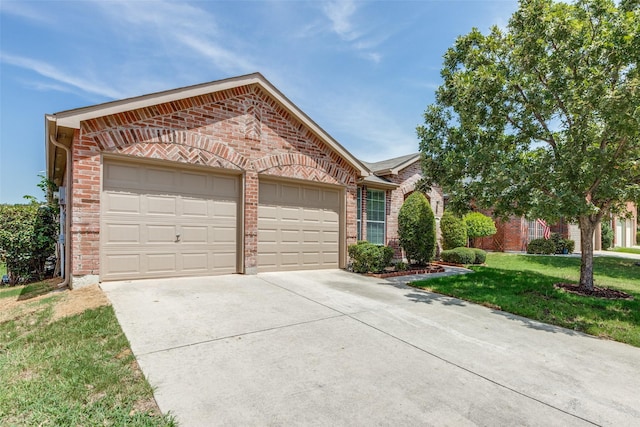 ranch-style home featuring a front lawn and a garage