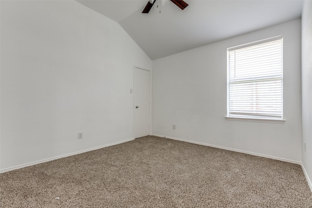 spare room featuring ceiling fan, carpet flooring, and lofted ceiling