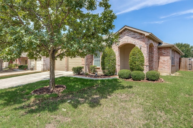 view of front of house featuring a garage and a front yard