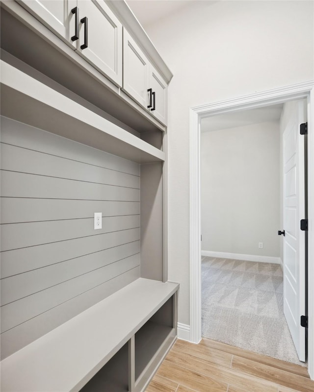 mudroom featuring light carpet