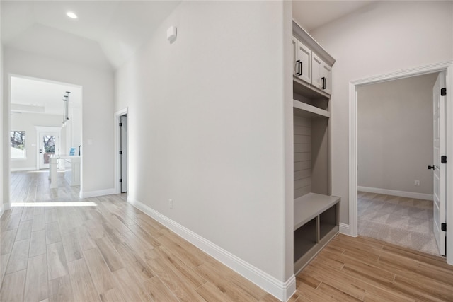 mudroom with vaulted ceiling