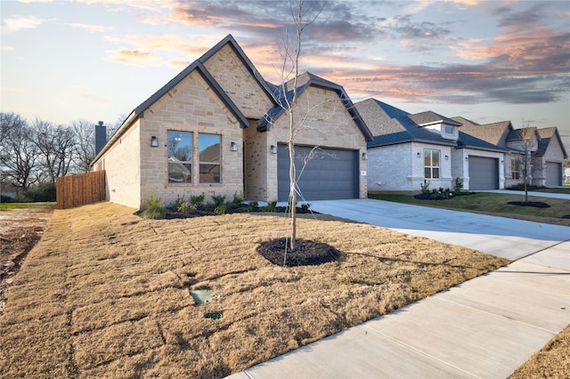 view of front of property featuring a yard and a garage