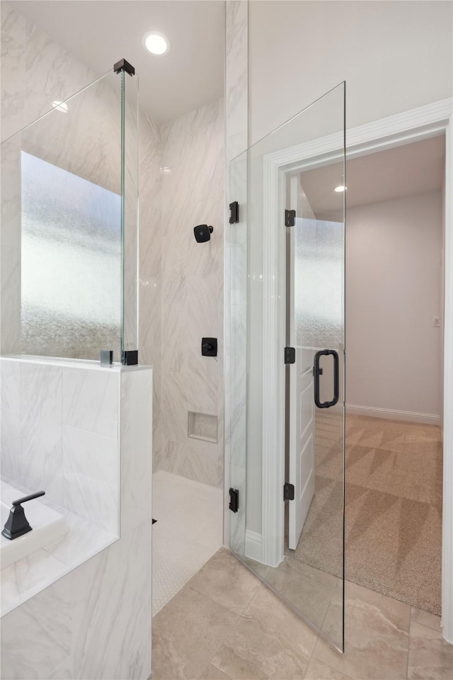 bathroom with a shower with shower door