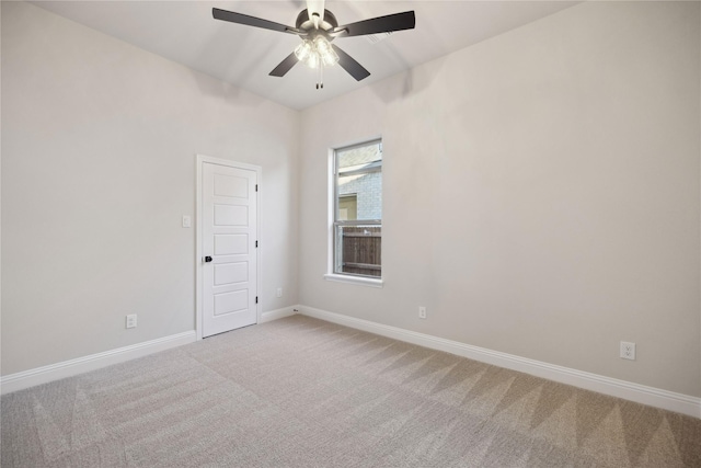 empty room with carpet flooring and ceiling fan