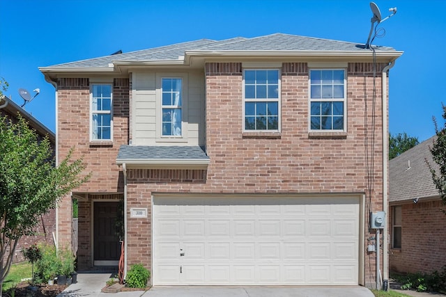 view of front of property featuring a garage