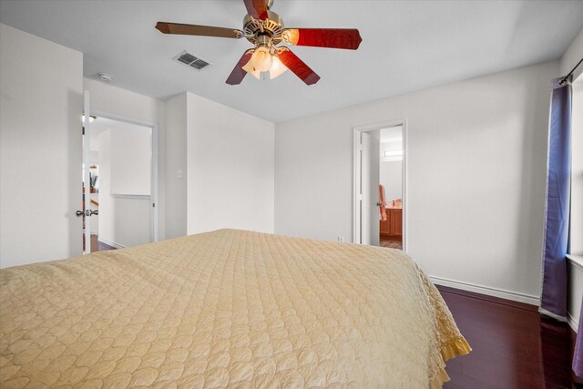 unfurnished bedroom with dark hardwood / wood-style floors, a spacious closet, and ceiling fan