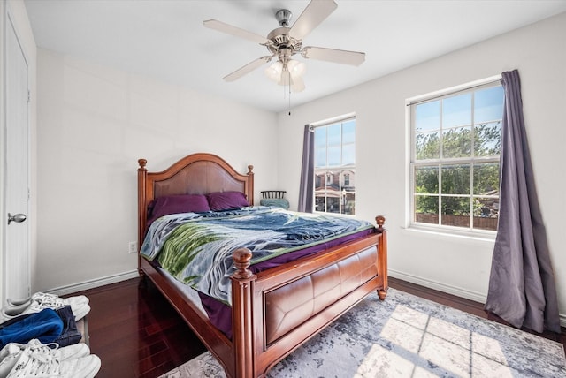 bedroom with hardwood / wood-style flooring and ceiling fan