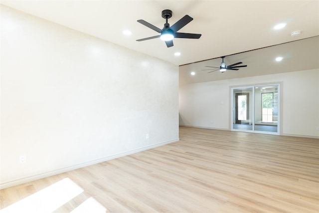 empty room featuring ceiling fan and light hardwood / wood-style flooring