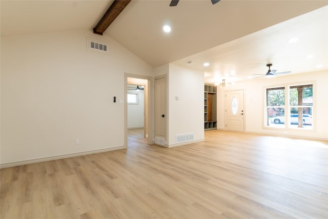 unfurnished living room featuring vaulted ceiling with beams and light wood-type flooring