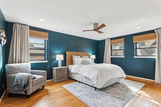 bedroom with ceiling fan, recessed lighting, wood finished floors, and baseboards