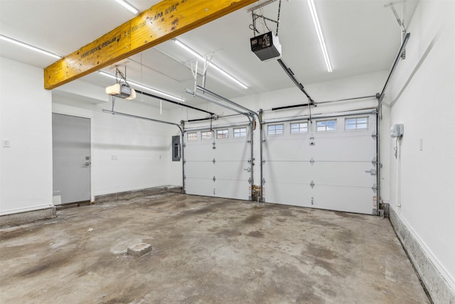 garage with electric panel and a garage door opener