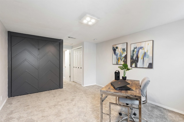 office with light carpet, visible vents, and baseboards