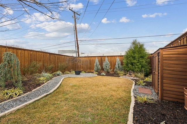 view of yard with a fenced backyard