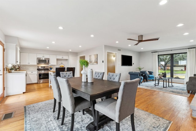 dining room with recessed lighting, visible vents, and light wood-style floors