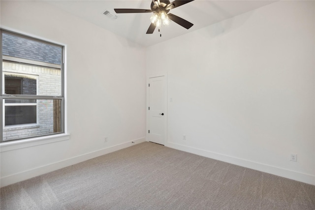 carpeted empty room with ceiling fan