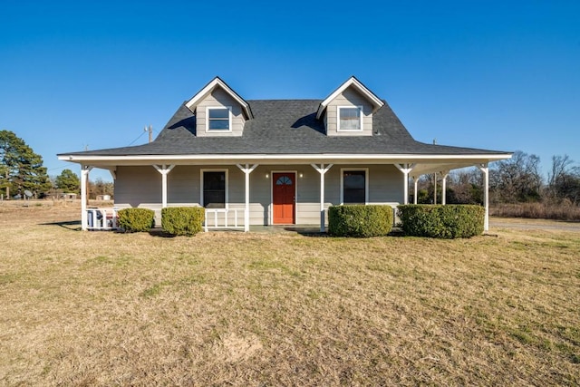 farmhouse featuring a porch and a front yard