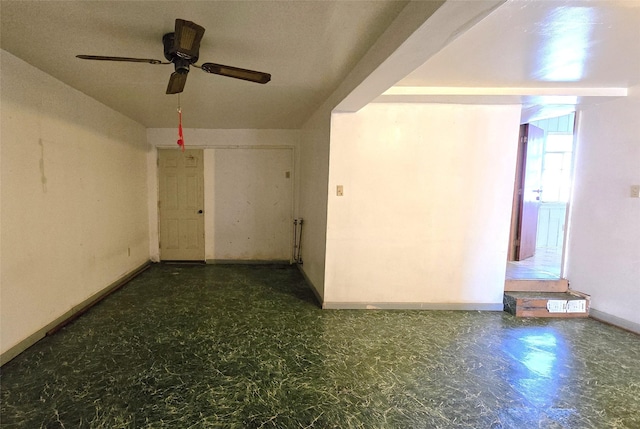 unfurnished room featuring ceiling fan