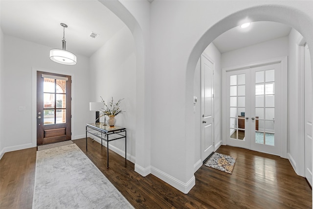 entrance foyer with dark wood-type flooring and french doors