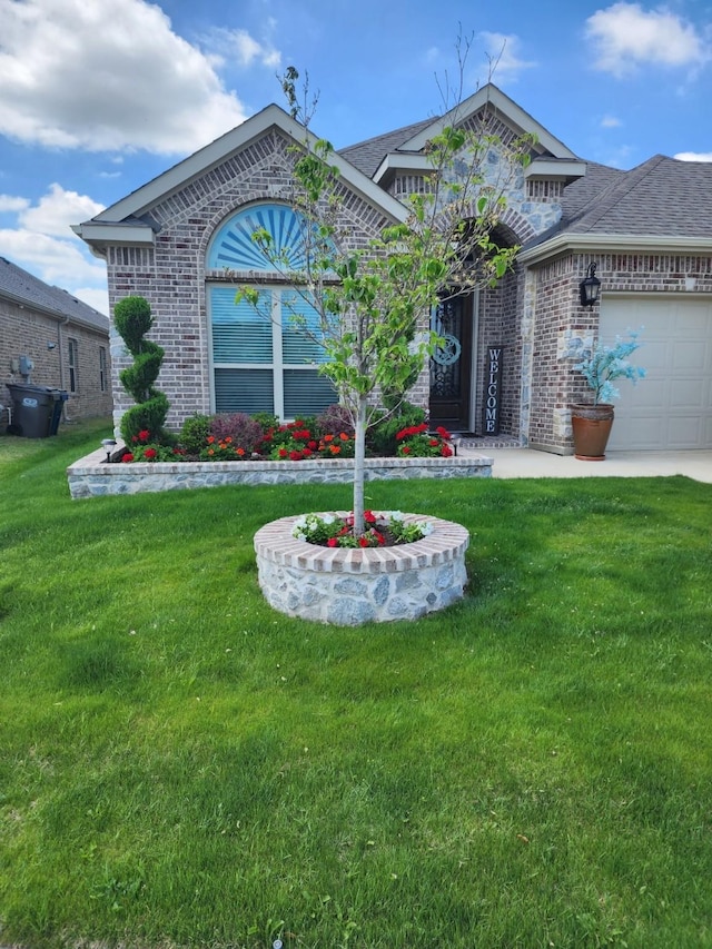 view of front facade featuring a garage and a front lawn