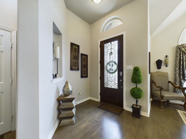 entrance foyer with dark hardwood / wood-style floors