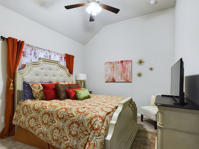 bedroom with lofted ceiling, carpet, and ceiling fan