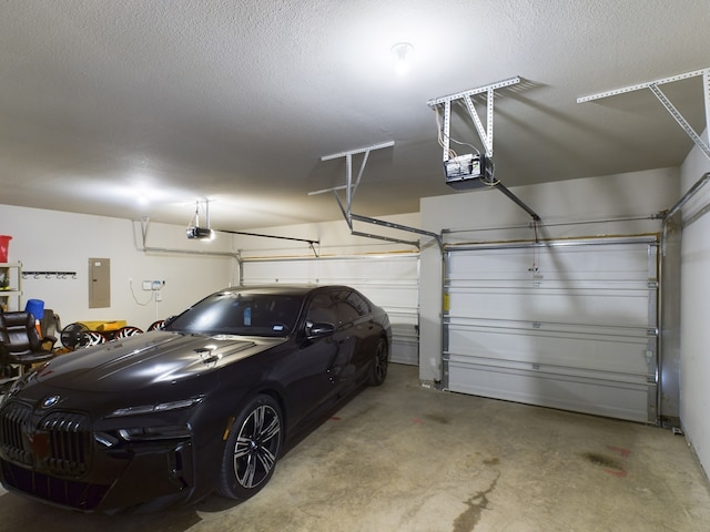 garage featuring a garage door opener and electric panel