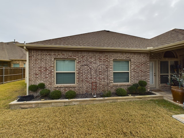 view of home's exterior featuring a yard