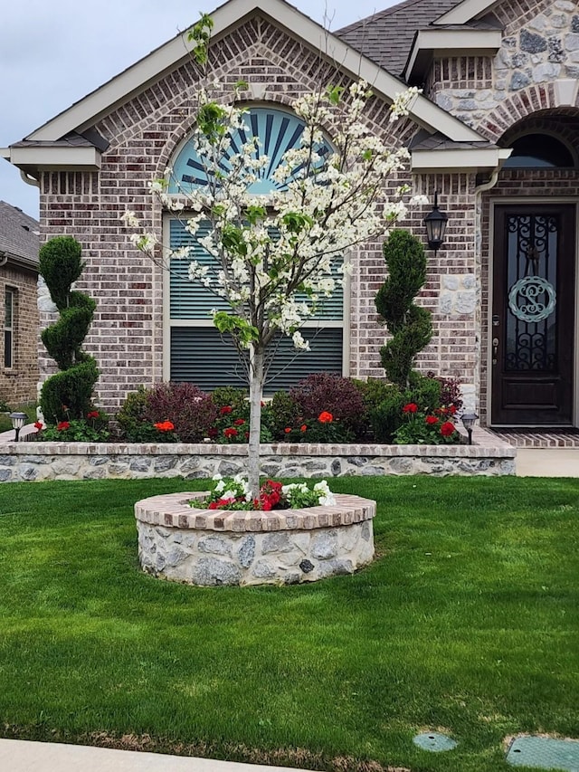 property entrance with a yard